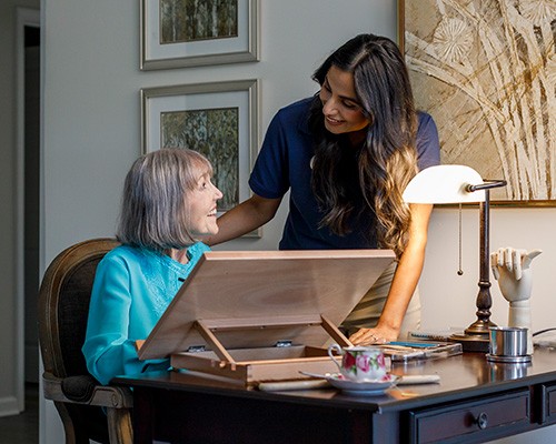 Caregiver Painting With Resident