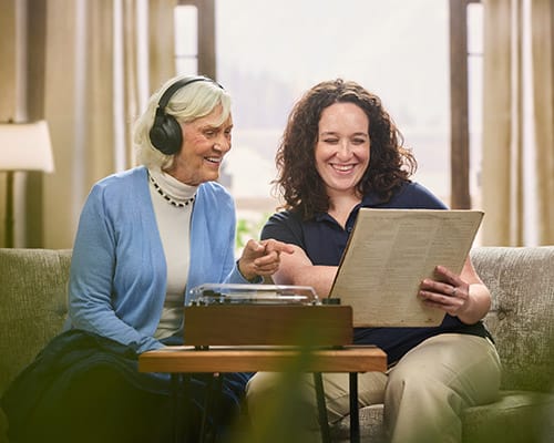 Resident and Caregiver Listening to Record