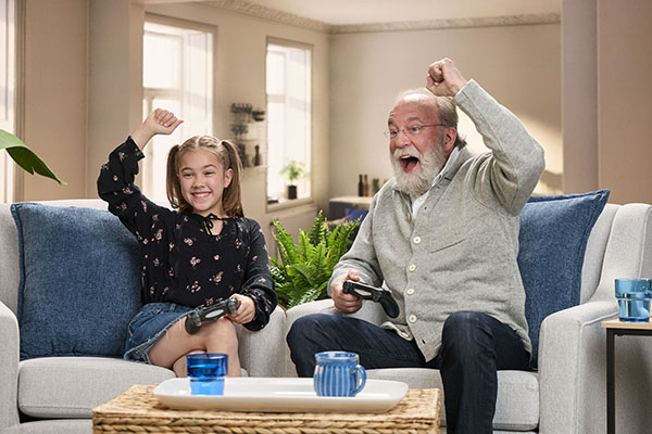 caregiver helping a resident put groceries away