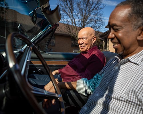 Two men in a convertible