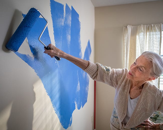 woman painting wall