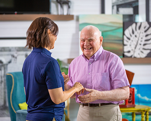 resident dancing with caregiver