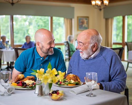 father and son having lunch