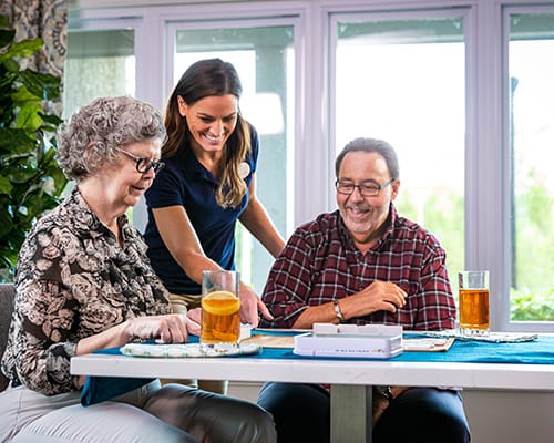 caregiver serving residents food