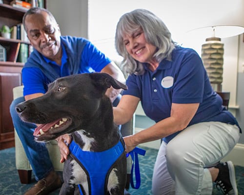 resident smiling with caregiver