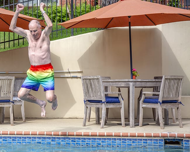 Man jumping into pool