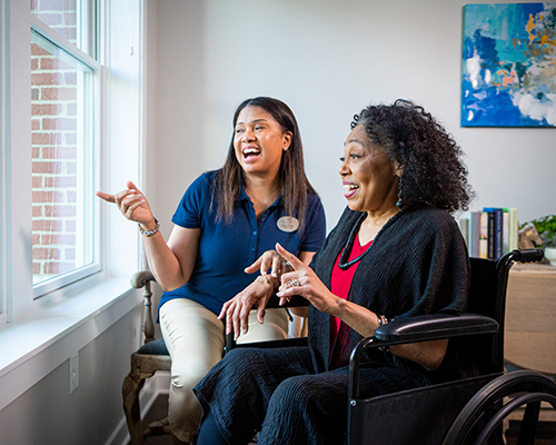 woman smiling with caregiver