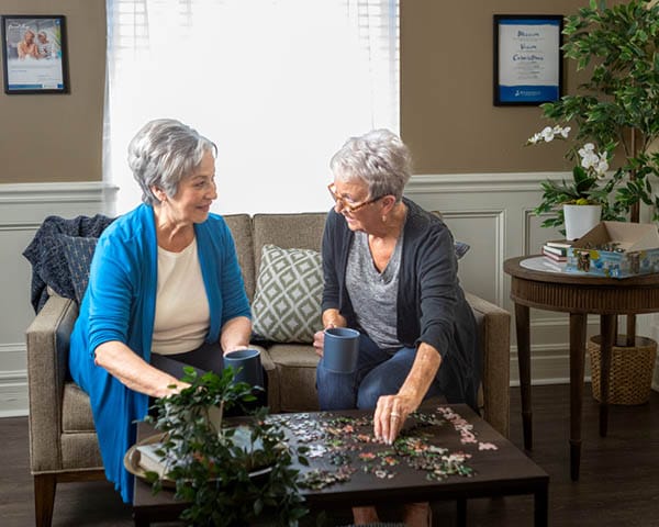 friends solving a puzzle