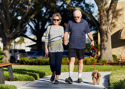 Brookdale couple walking their dog