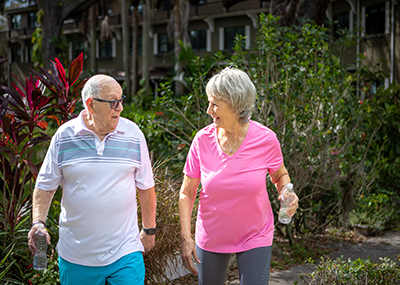 older couple walking outside