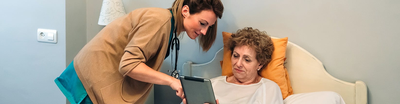 doctor consulting chart with woman