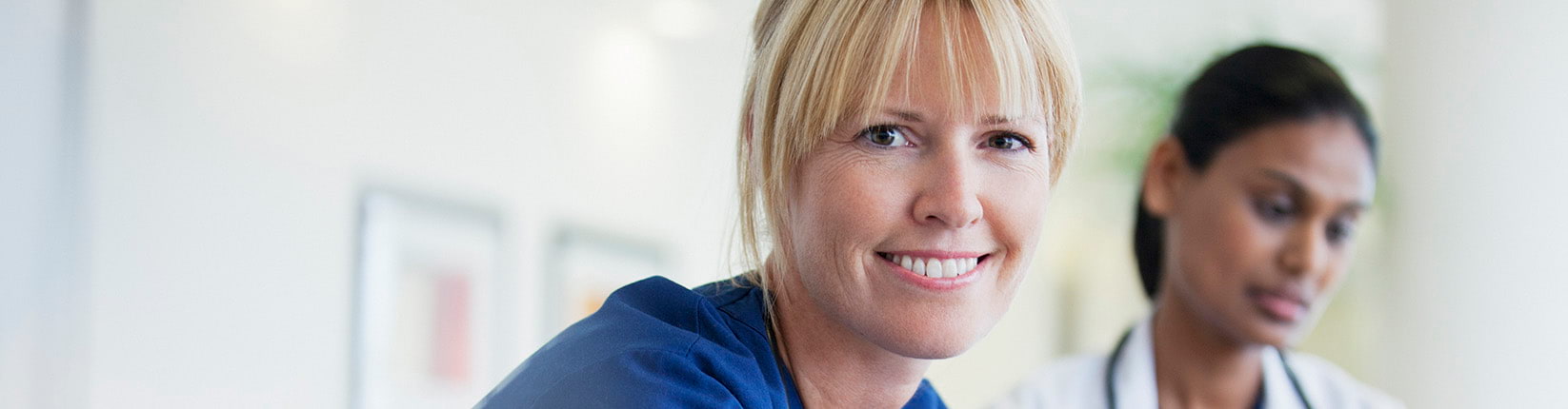 two nurses smiling