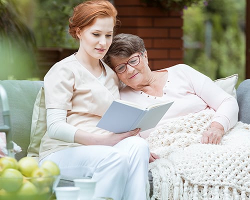 woman and nurse reading woman and nurse reading
