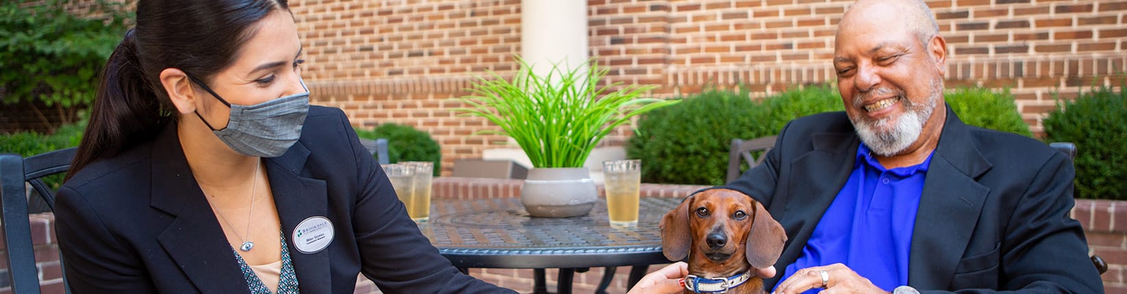 man with dog and associate