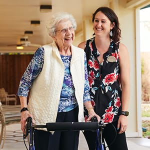 man and caregiver gardening