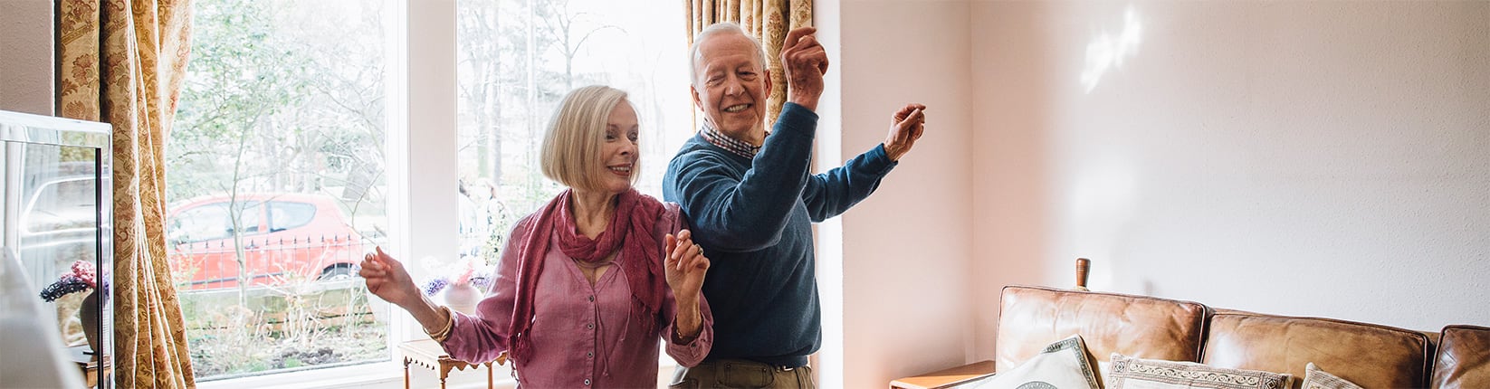 couple dancing in living room
