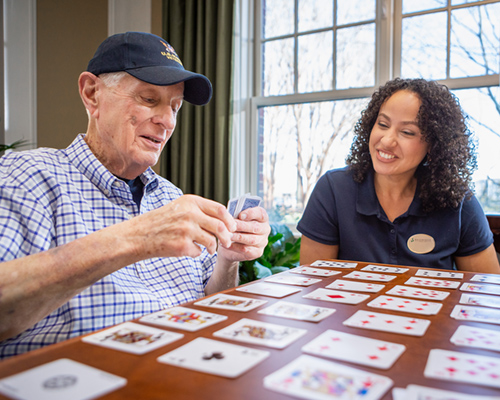 caregiver walking with a resident