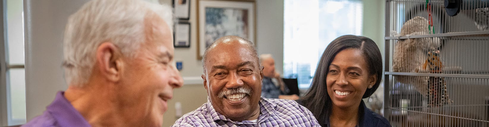 Caregiver and residents smiling