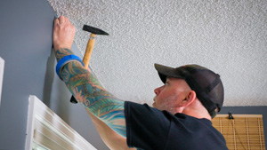  Design team member uses hammer