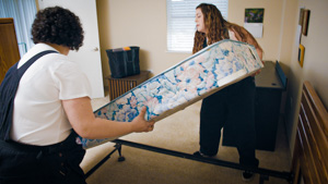  Team members moving mattress